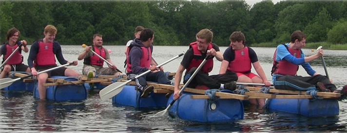 A group of people on a training raft.