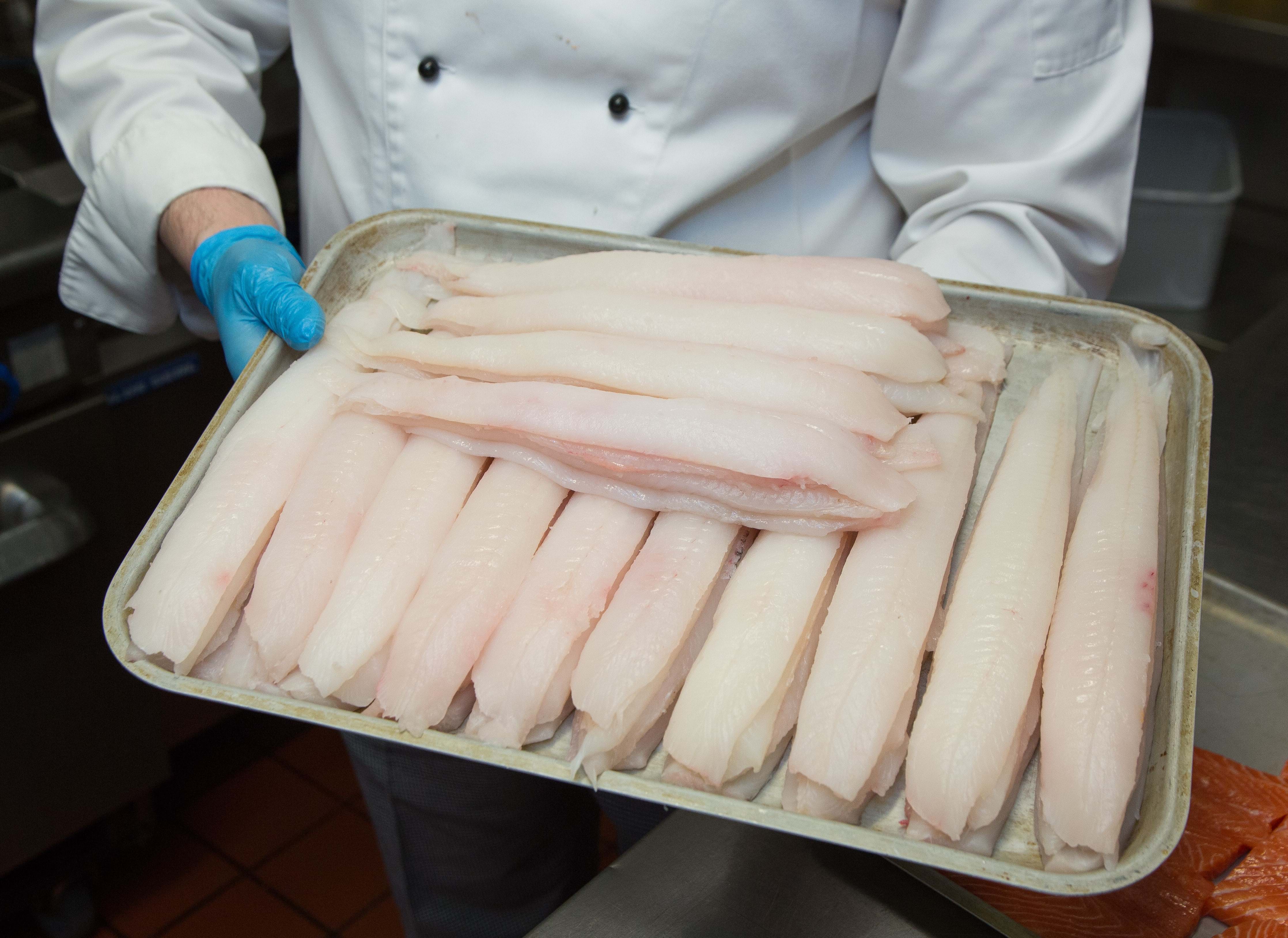 Photo of a tray of whitefish fillets