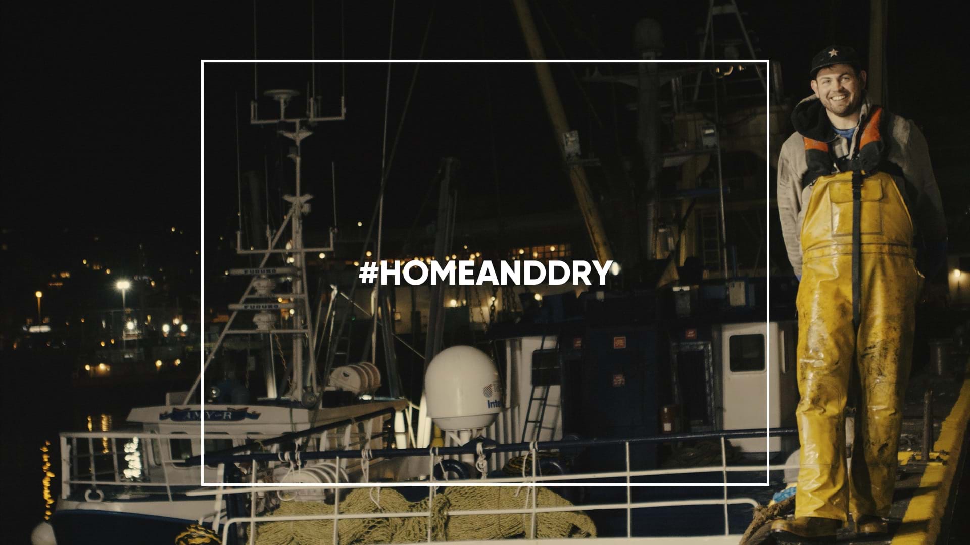 Image of fishermen on quay from Home and Dry campaign