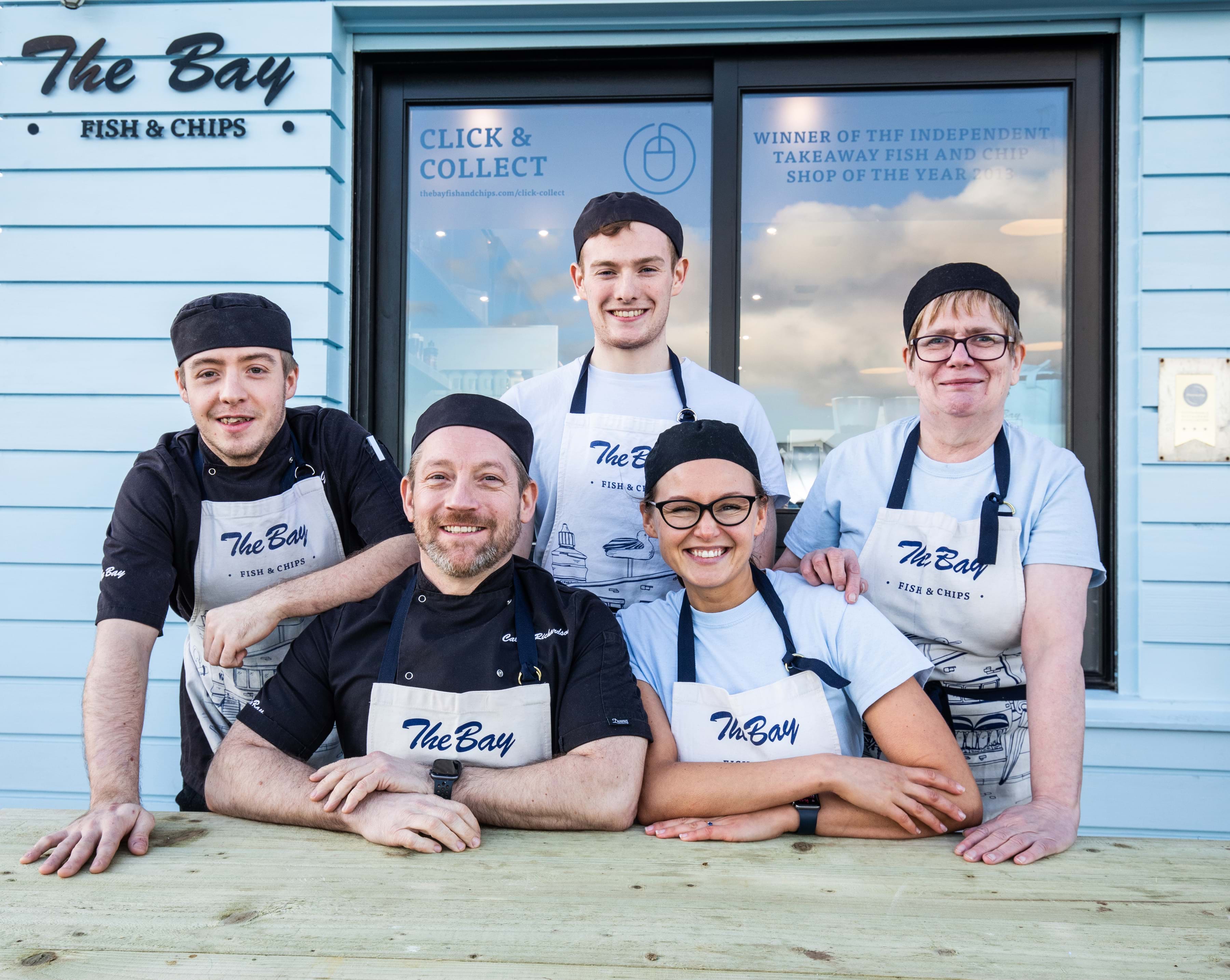 Photo of the team working at The Bay fish and chip shop