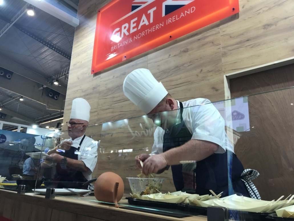 Chefs working on seafood to provide to guests at Barcelona Expo
