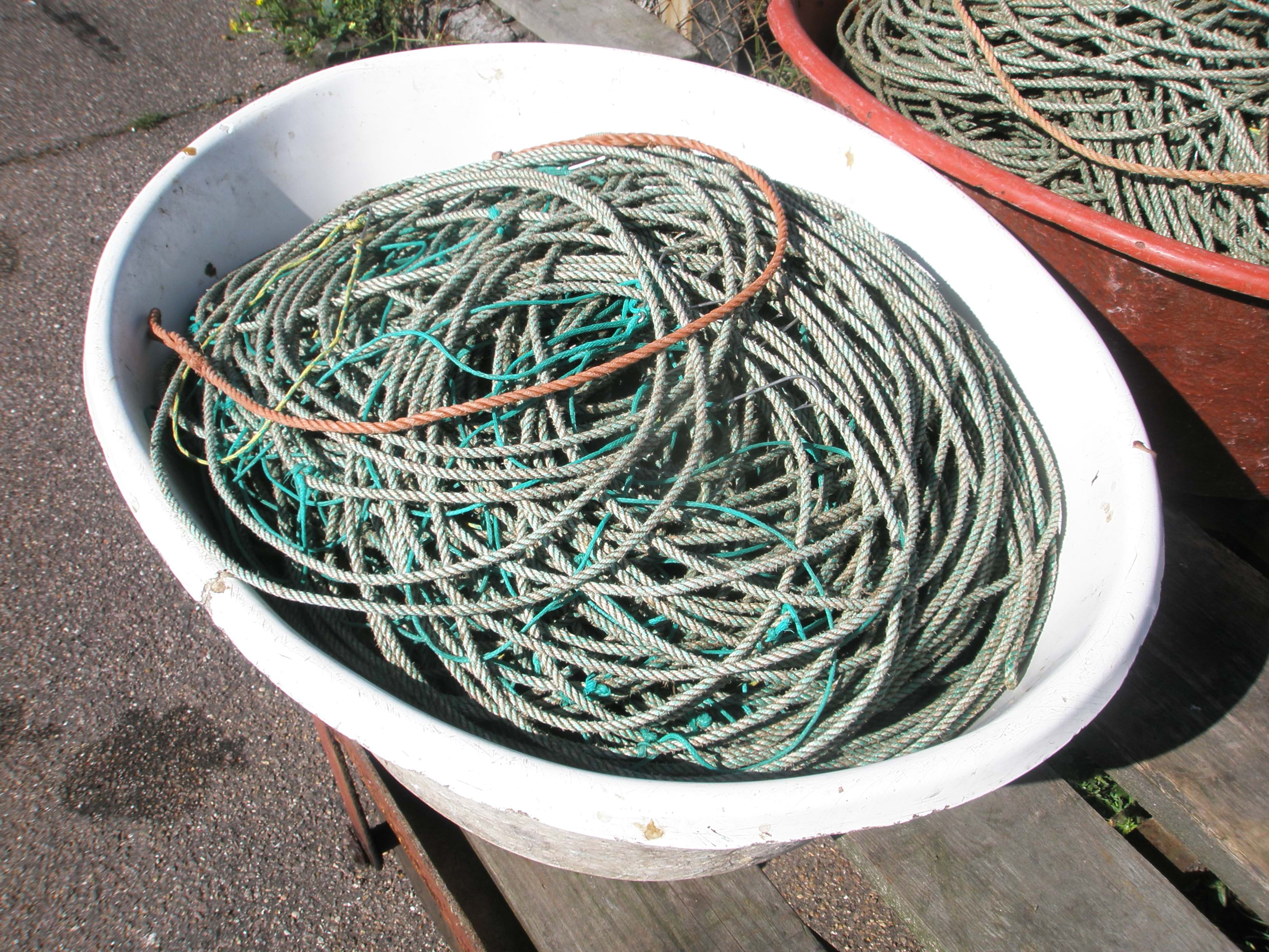 Round tubs filled with inshore small lines