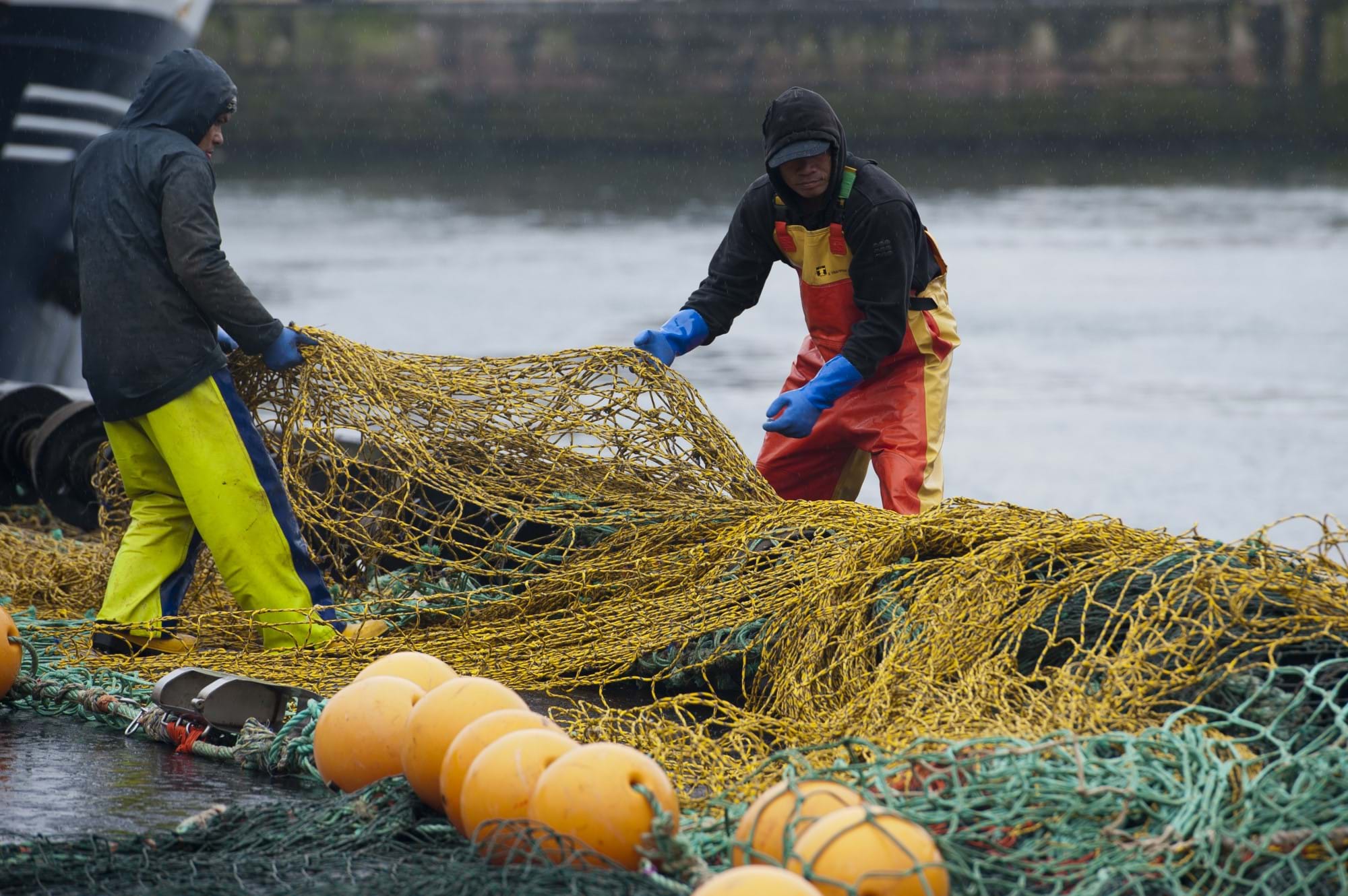 Crew working with nets on harbour