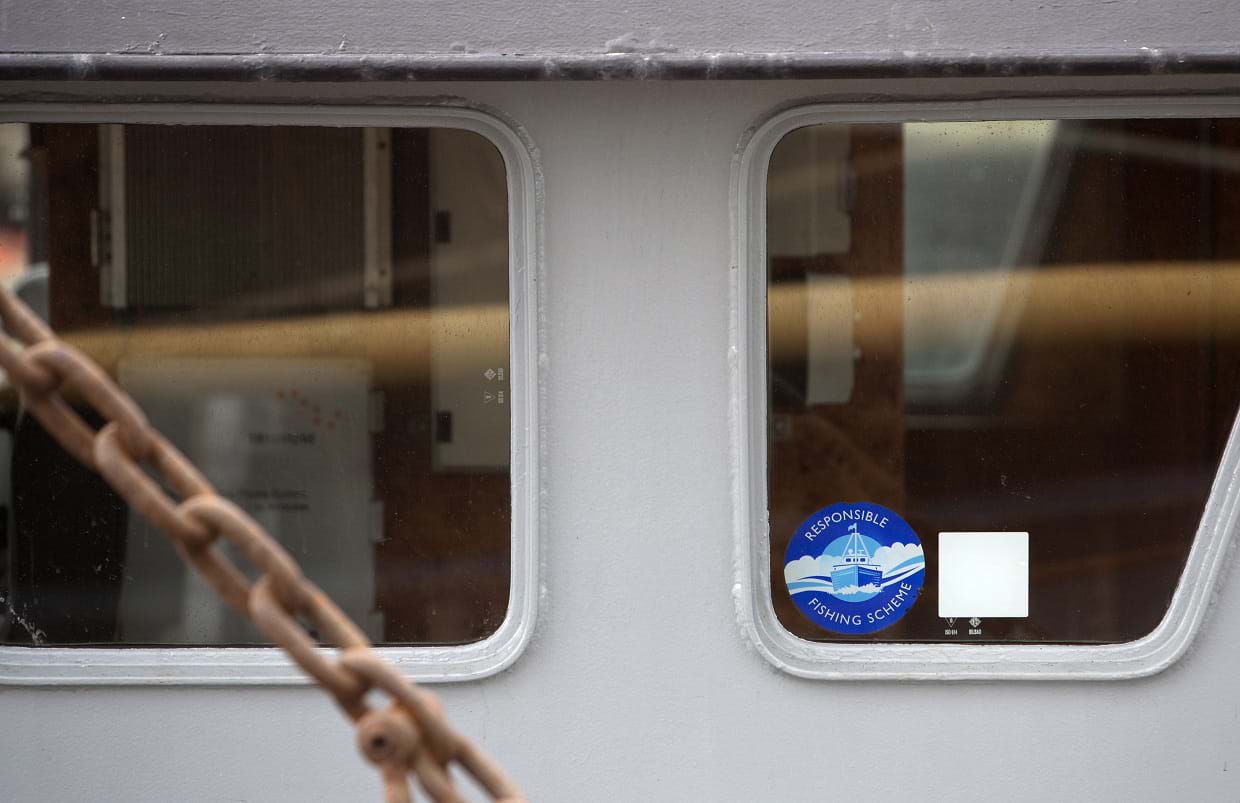 Photo with close up view of window on fishing vessel wheelhouse