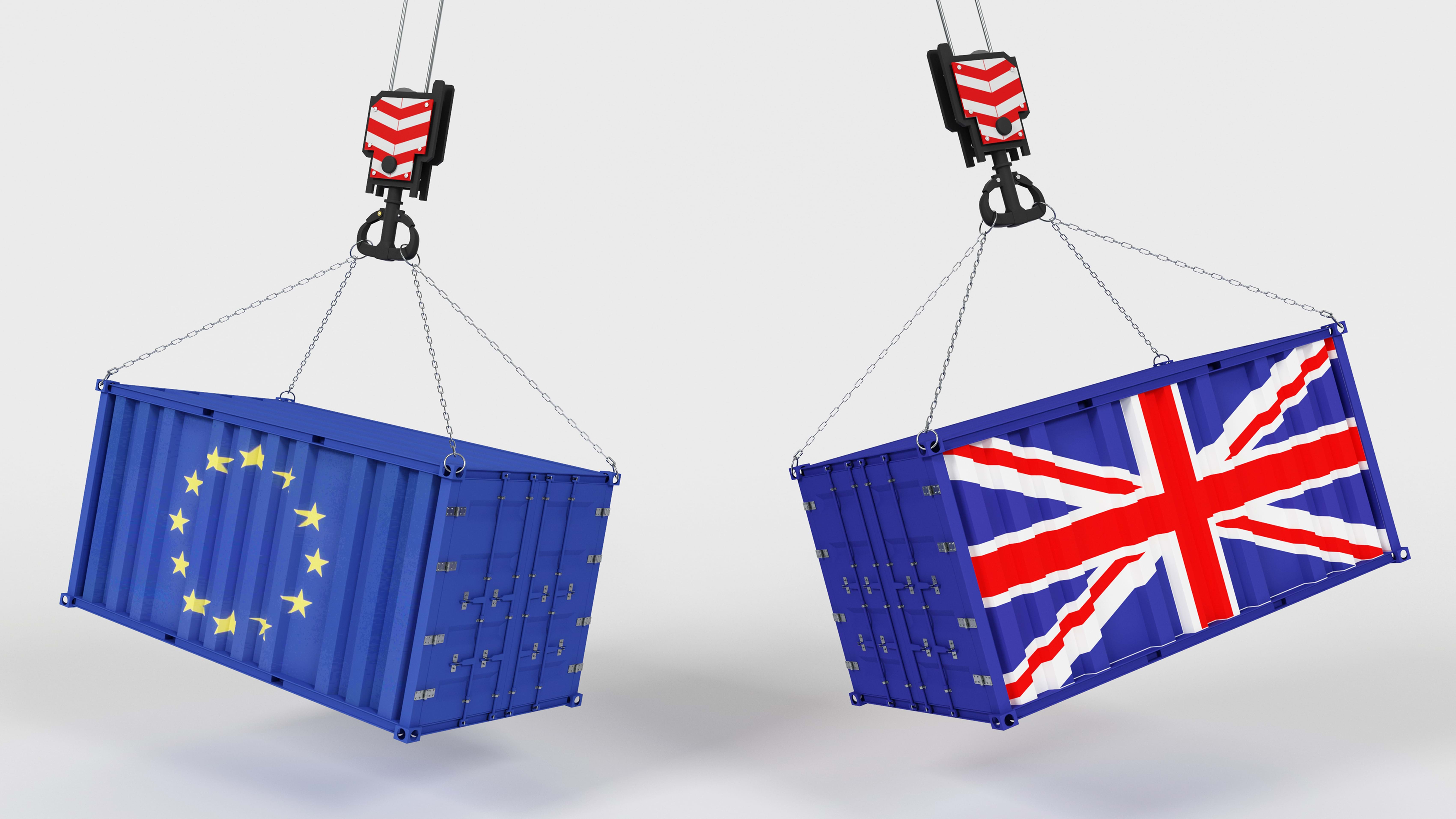 Two freight containers, one showing the flag of Europe and the other showing the Union Jack flag