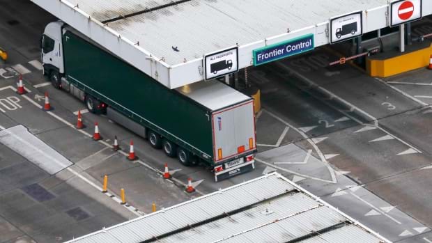 Photos shows a large lorry parked in a border control bay.