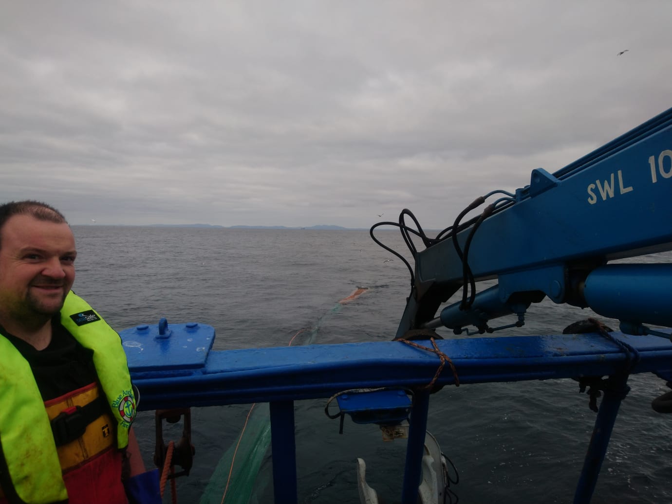Photo of Mark Newlands out at sea on his fishing vessel.