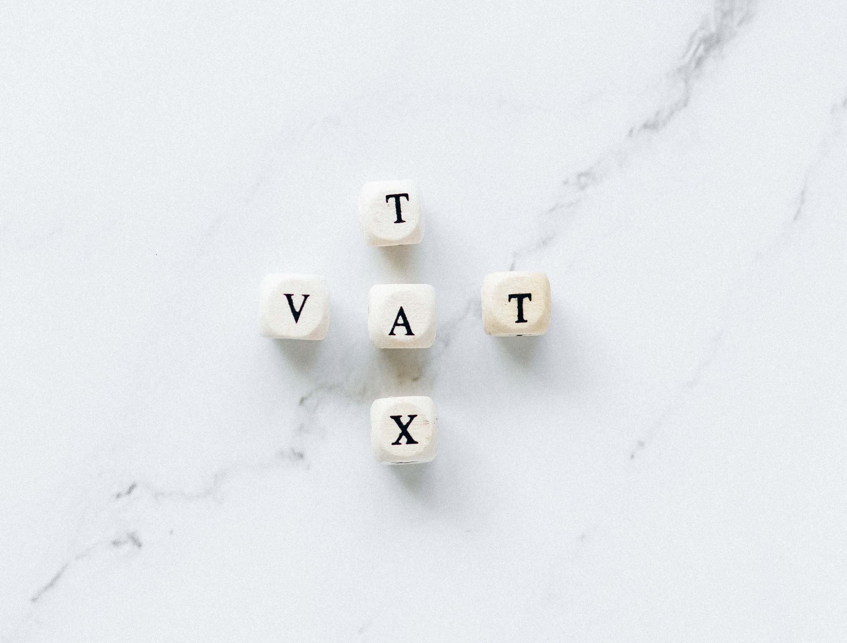 Dice spelling out 'Tax' and 'VAT'